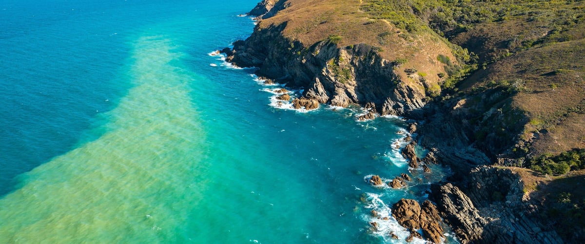 Byfield National Park featuring landscape views, rugged coastline and general coastal views