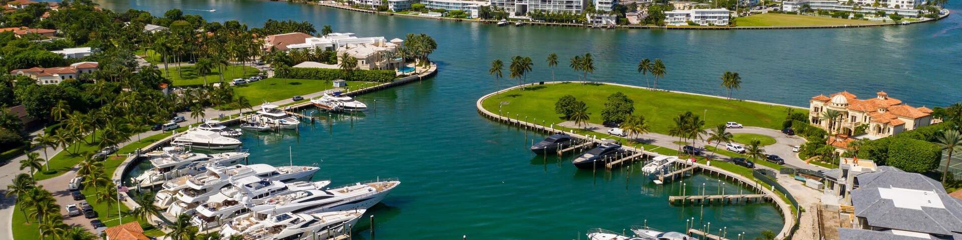 Bal Harbour marina with luxury yachts Miami Beach FL aerials