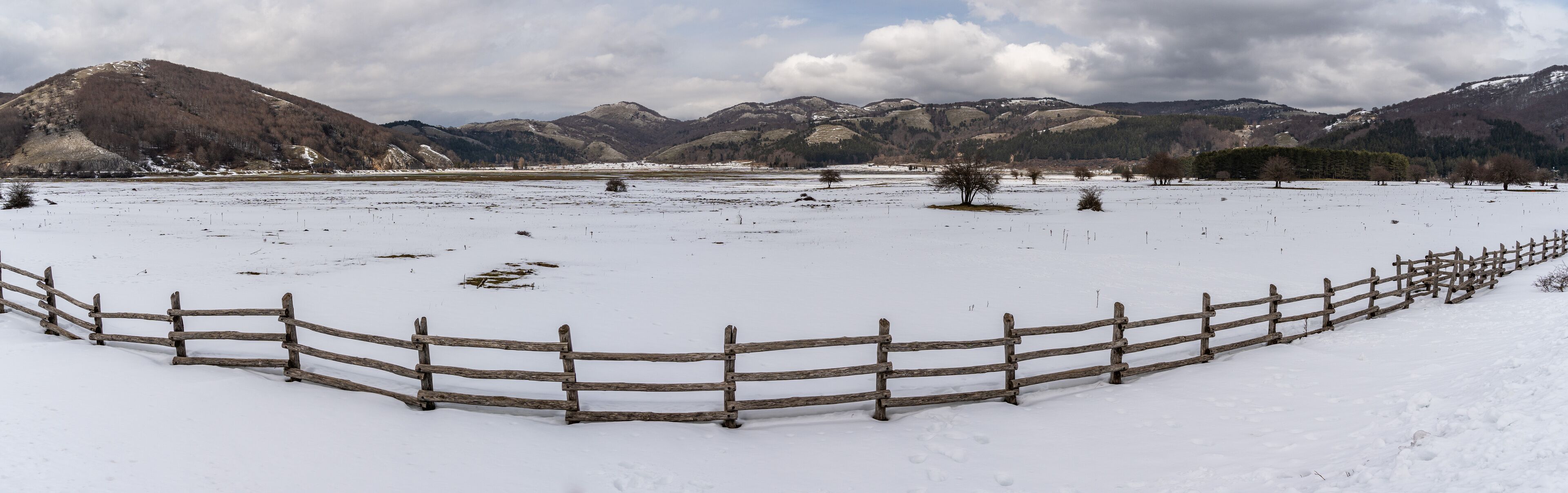 Wide panoramic view of Laceno Lake during winter season, Campania region, Italy