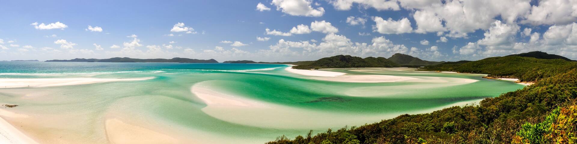 XXL panorama of Whitehaven Beach on Whitsunday Island in Queensland, Australia. The popular tourist destination is known for its pure white sands. Accessible from Airlie Beach, near Hamiltion Island.