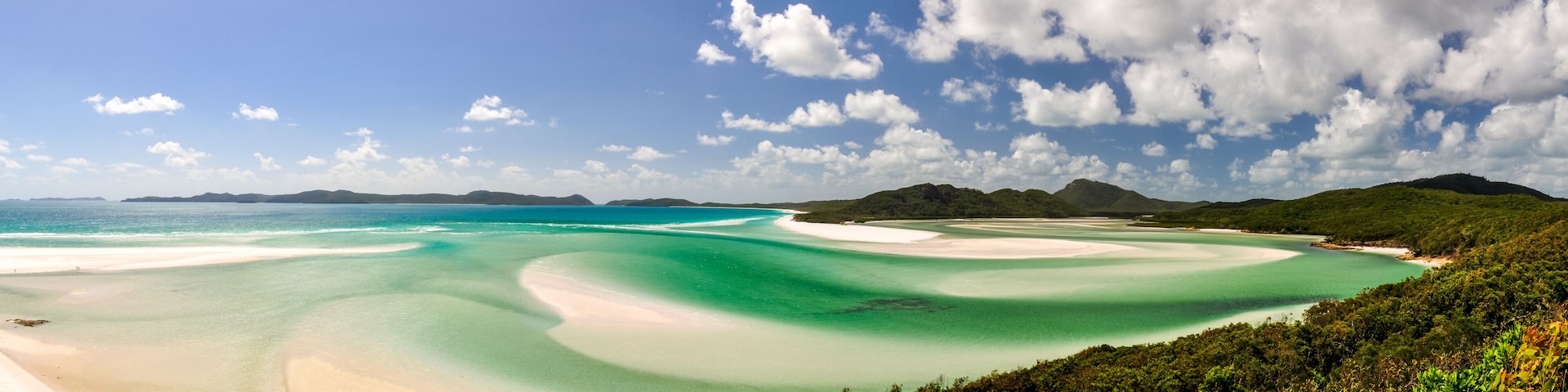 XXL panorama of Whitehaven Beach on Whitsunday Island in Queensland, Australia. The popular tourist destination is known for its pure white sands. Accessible from Airlie Beach, near Hamiltion Island.