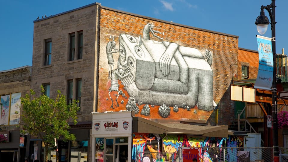 Et murmaleri viser en sofa på en murstensbygning, en gadelygte og et skilt for Montreal Festival.