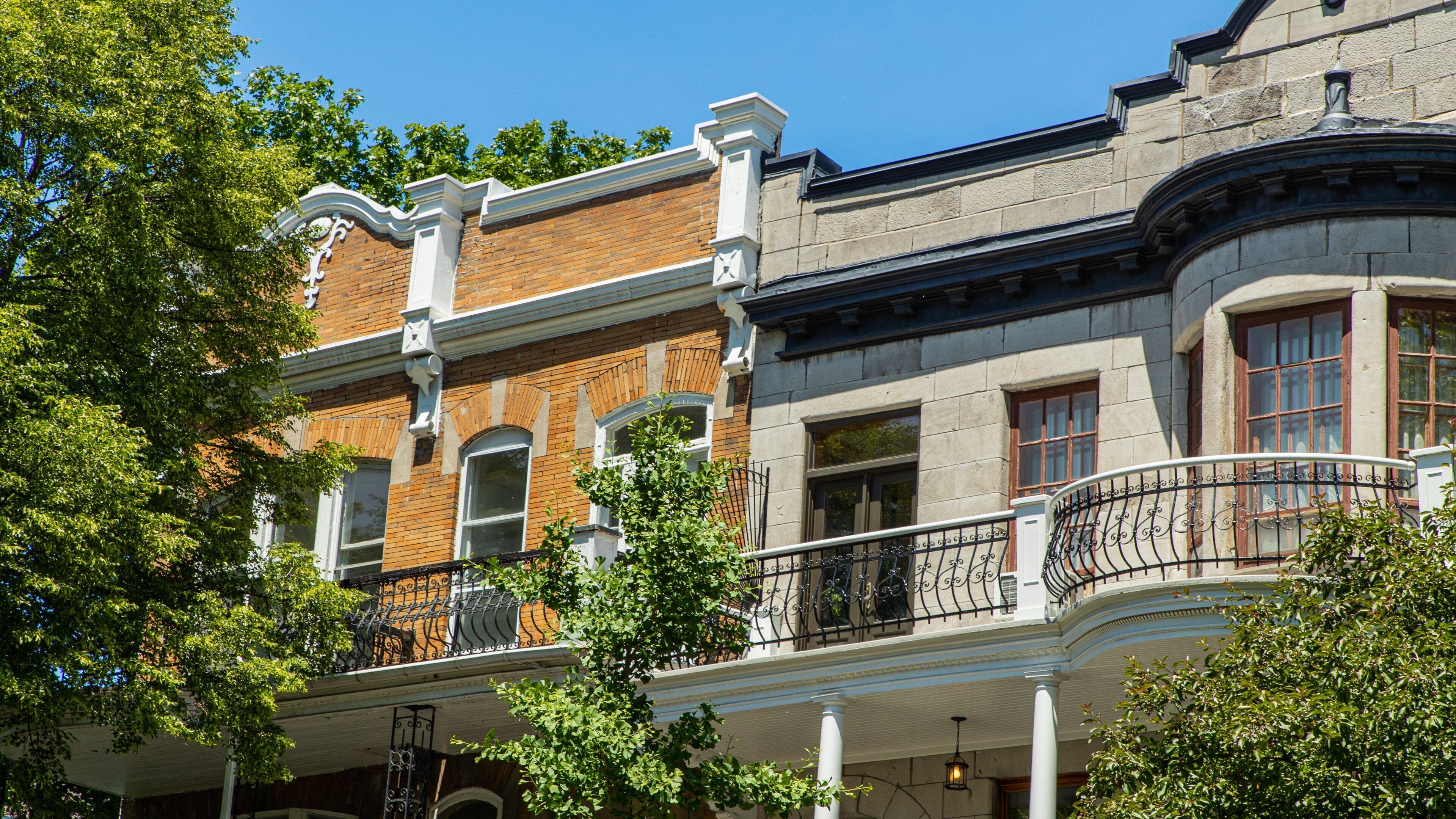 A historic building with ornate balconies and a brick facade.