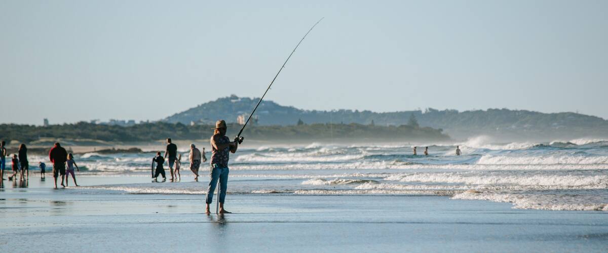 Alex Beach showing fishing, general coastal views and a sandy beach