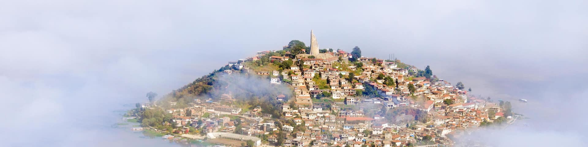 Aerial view of the island of Janitzio surrounded by clouds in Lake Patzcuaro, Michoacan, Mexico.
