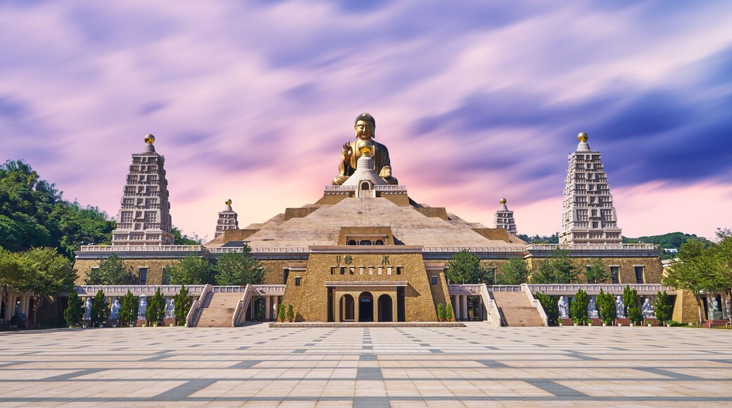 Kaohsiung, Taiwan - December 3, 2018: Many tourist walked to the Fo Guang Shan Buddha Memorial center in beautiful sunset scenic time at Kaohsiung city, Taiwan.