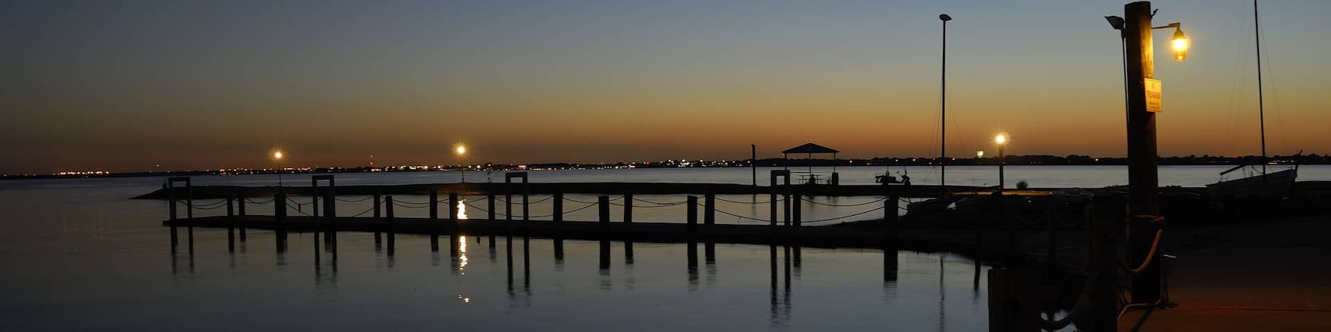 The daylight giving way to the night sky at the fishing pier at Chandlers Landing on Lake Ray Hubbard, Rockwall Texas.; Shutterstock ID 46904704