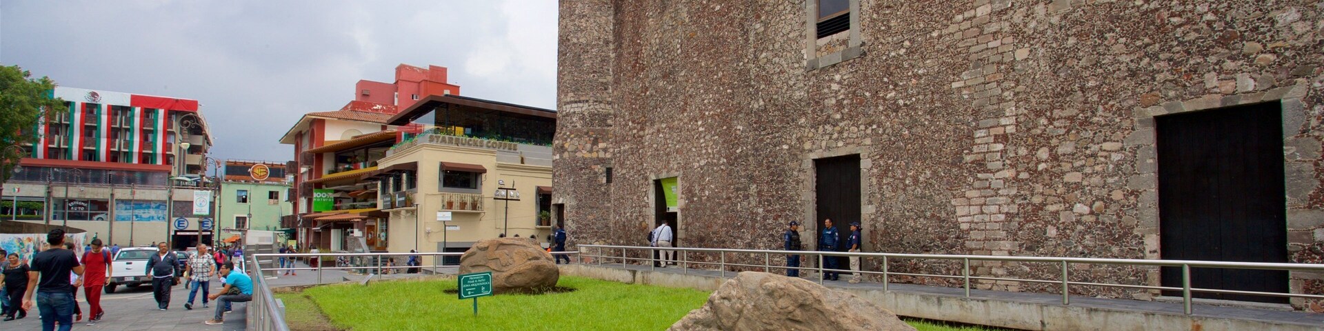 Palace of Cortes Museum showing heritage elements and a garden