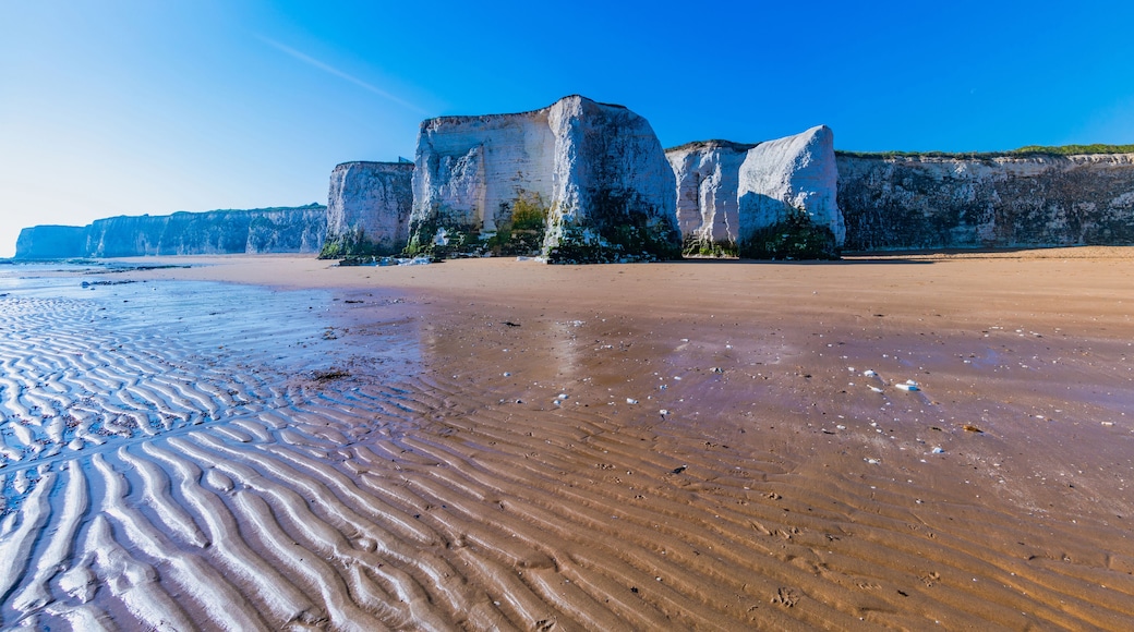 View of white chalk stacks, cliffs, sea at low tide and beach in Botany Bay, Margate, East Kent, UK