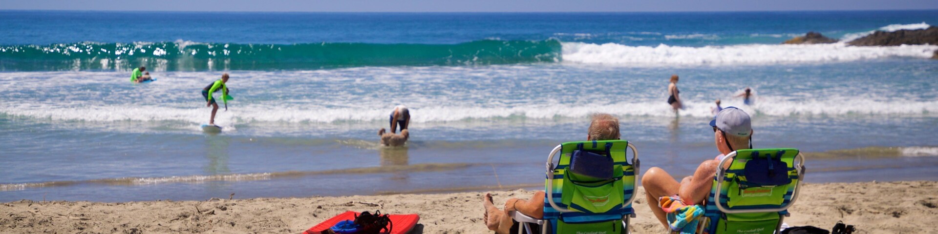 Los Cerritos Beach which includes a sandy beach and general coastal views as well as a couple