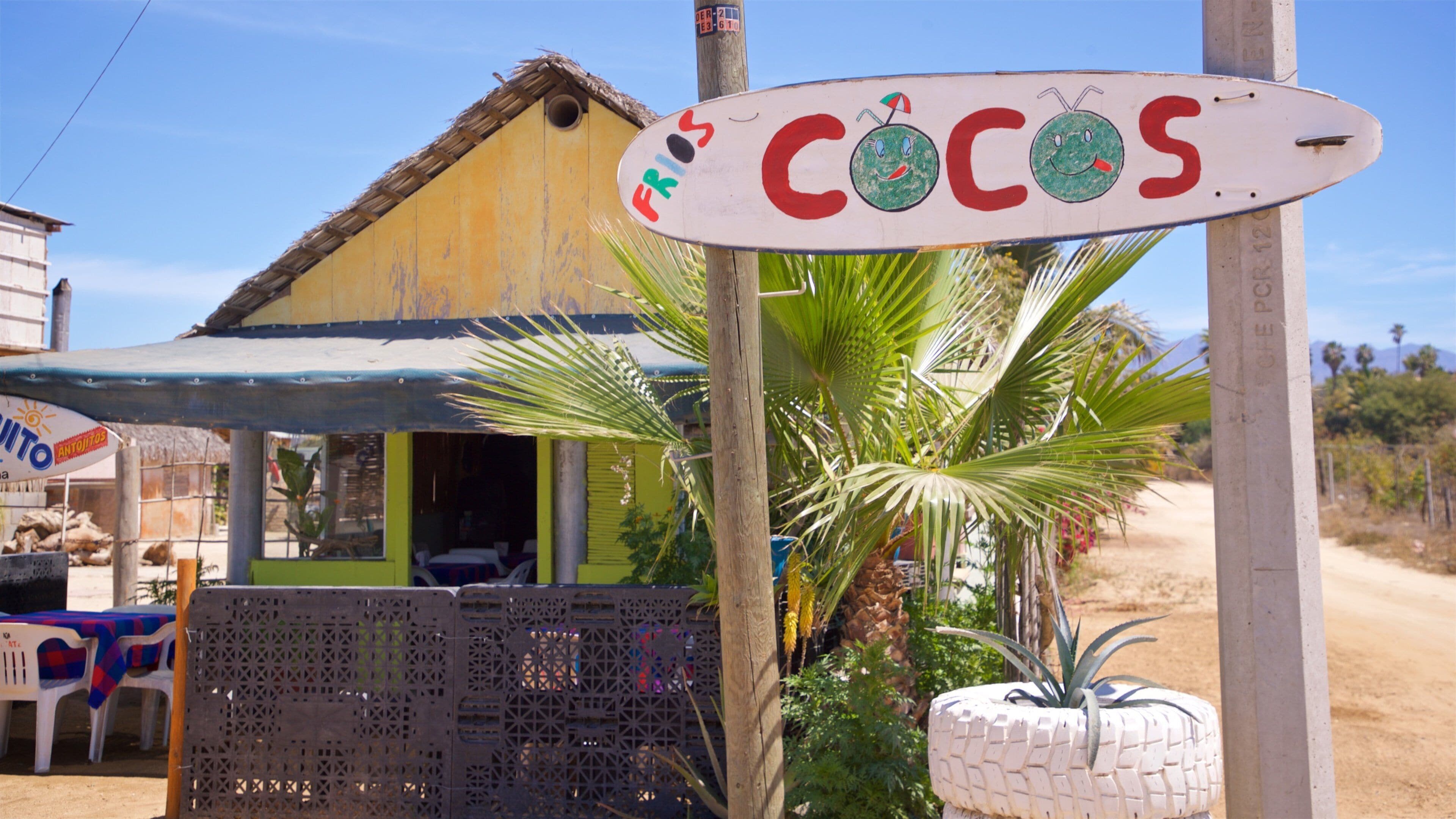 Los Cerritos Beach featuring a small town or village and signage