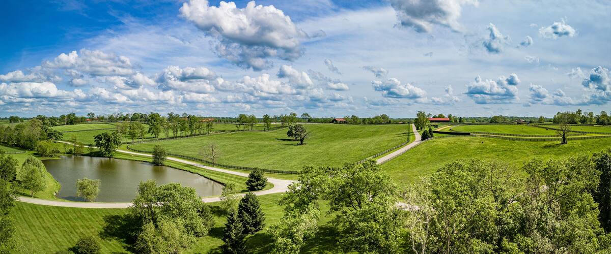Trails, pastures and a pond on the grounds of horse farm in rural Kentucky