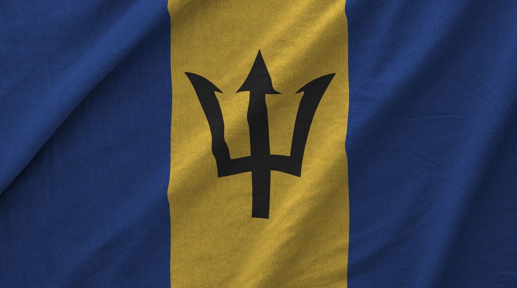 Barbados flag depicted on folded wavy fabric of old cloth close up