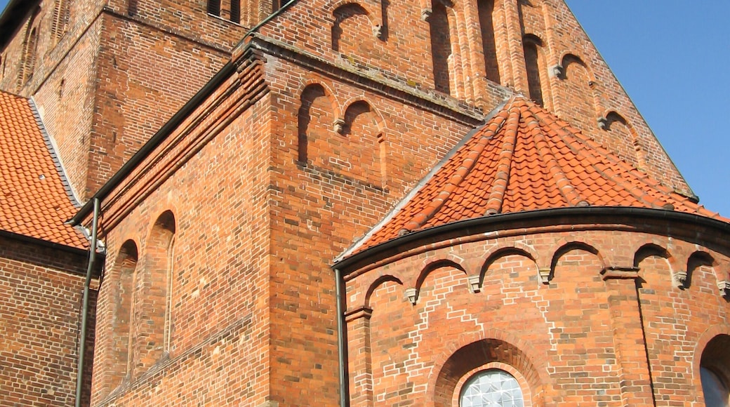 Looking up at the belltower of the 13’th century brick church at the cannon monastery in the German Town of Bassum on a clear sunny day.