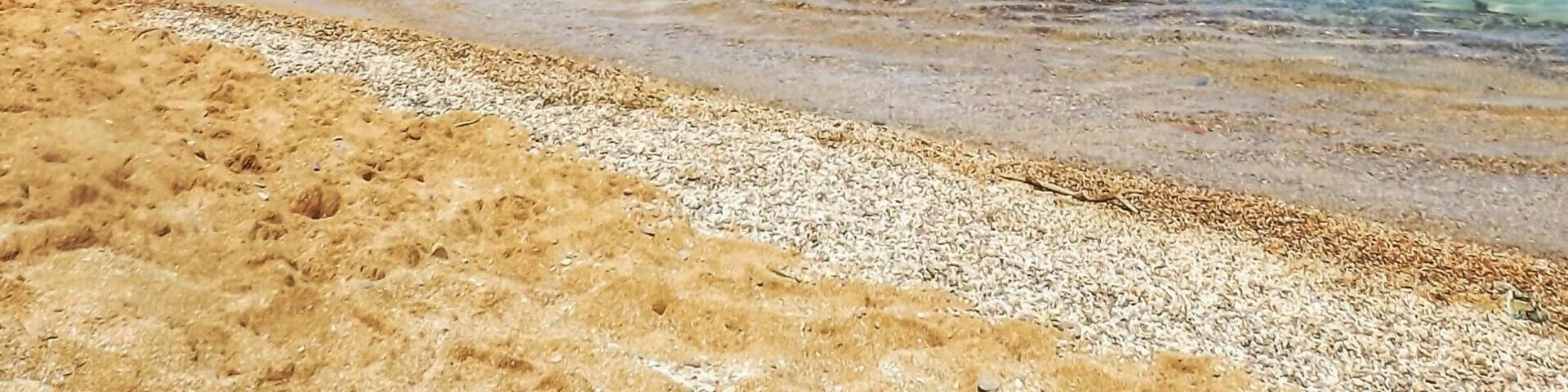 Cala Pregonda in Menorca island (Spain). A perfect place to admire the combination of orange, blue and white colors.