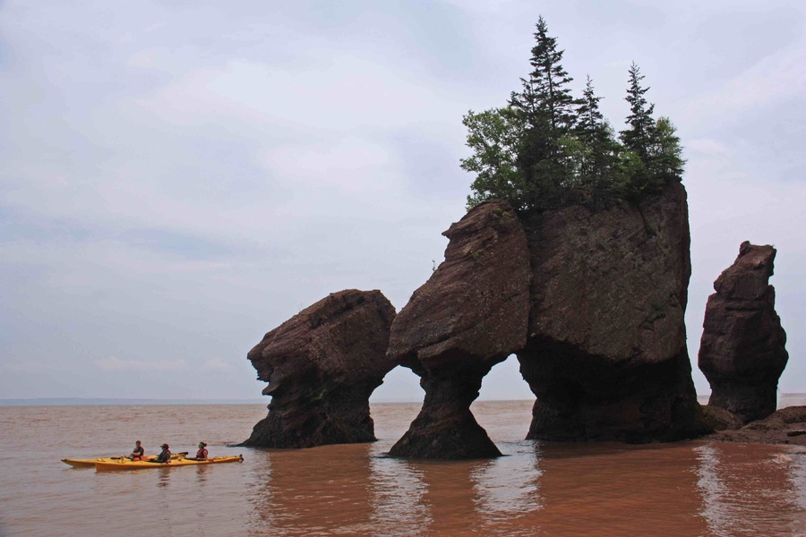 Kayaking in the Bay of Fundy around the Hopewell Rocks in New Brunswick. The highest tides in the world. We were walking around and under these rocks a few hours later.