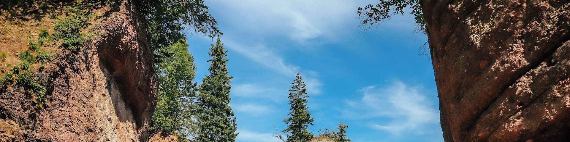 When in New Brunswick you must visit Hopewell Rocks before more pillars come tumbling down. These pillars (also known as flower pots) have been caused by tidal wave erosion and span up towards 70 feet tall. During low tide you can walk along the ocean floor to catch a close up view of their enormous size. As this is a very popular tourist spot, during the summer months you can expect it to be extremely busy. Parking is free but there is a fee to go into the park to see the rocks. If you want to walk on the ocean floor, I recommend that you check their website before you are expecting to leave to view when low tides will occur as this is the only time you can do this. The park is dog-leash pet friendly (meaning keep your dog on a leash and all will be well) - however dogs are not permitted in any of the main buildings such as the gift shop etc. There is a playground area for the kiddies, a small cafeteria style restaurant, gift shop, washrooms, and information station. If you view all the key highlights of the park you can expect to spend about 3 hours here with a total hiking / walking time of approx. 6 to 7 KM with some trails at steeper elevations (such as the beach trail).