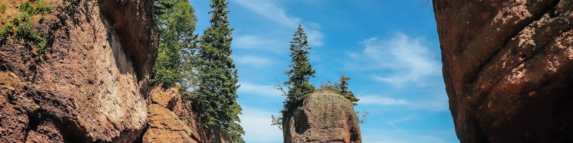 When in New Brunswick you must visit Hopewell Rocks before more pillars come tumbling down. These pillars (also known as flower pots) have been caused by tidal wave erosion and span up towards 70 feet tall. During low tide you can walk along the ocean floor to catch a close up view of their enormous size. As this is a very popular tourist spot, during the summer months you can expect it to be extremely busy. Parking is free but there is a fee to go into the park to see the rocks. If you want to walk on the ocean floor, I recommend that you check their website before you are expecting to leave to view when low tides will occur as this is the only time you can do this. The park is dog-leash pet friendly (meaning keep your dog on a leash and all will be well) - however dogs are not permitted in any of the main buildings such as the gift shop etc. There is a playground area for the kiddies, a small cafeteria style restaurant, gift shop, washrooms, and information station. If you view all the key highlights of the park you can expect to spend about 3 hours here with a total hiking / walking time of approx. 6 to 7 KM with some trails at steeper elevations (such as the beach trail).
