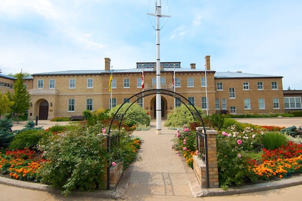 Government House showing flowers, an administrative buidling and a square or plaza
