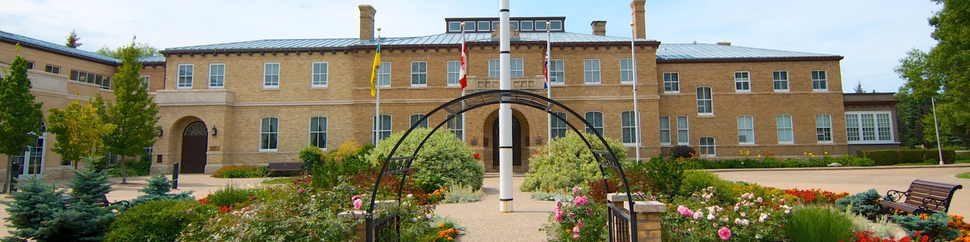 Government House showing flowers, an administrative buidling and a square or plaza