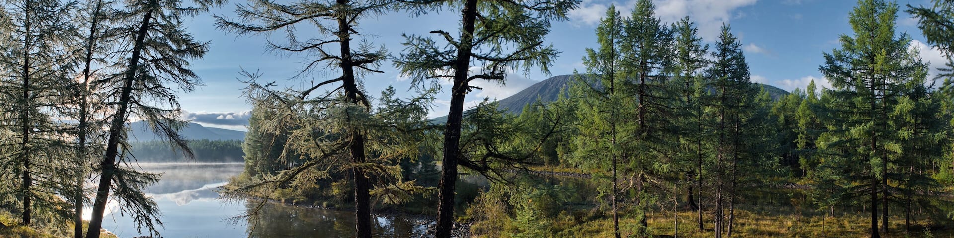 Russia, Western Buryatia. Early morning on the deserted taiga lake Guzen-Nur, hidden from prying eyes, on the left bank of the Tisa River.