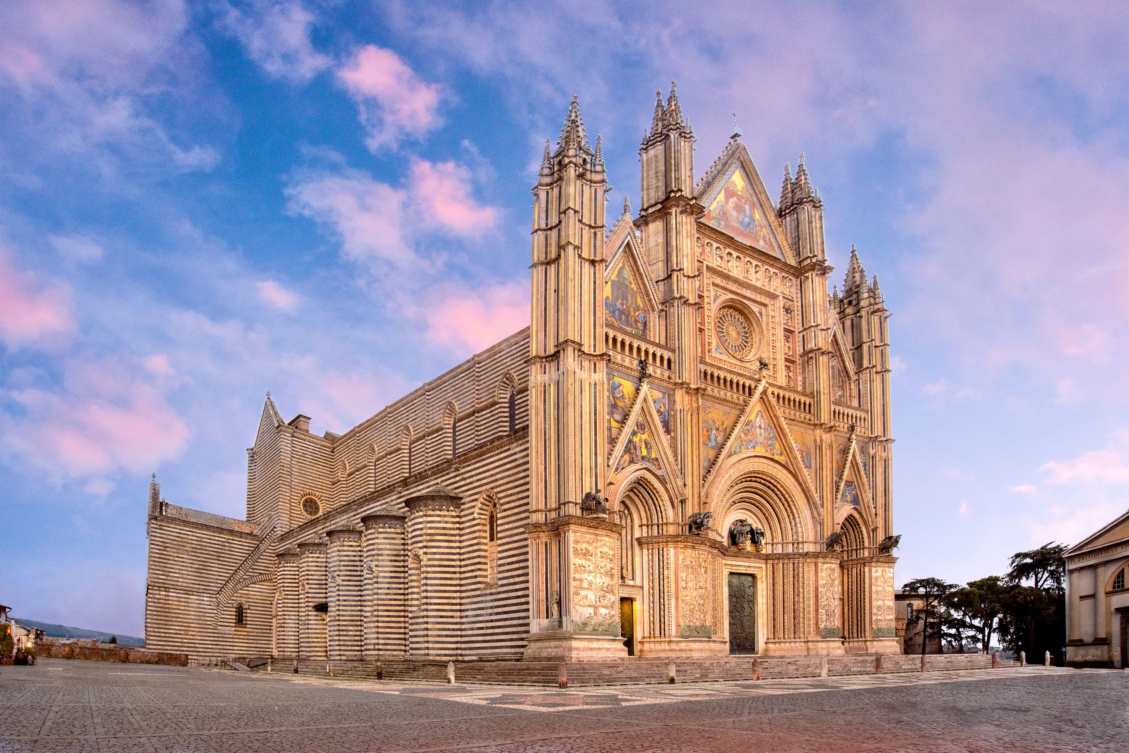 A large, ornate cathedral with intricate architectural details and a prominent rose window.