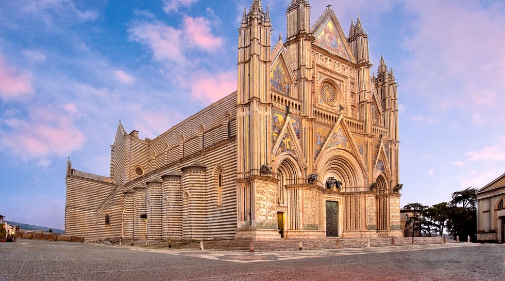 A large, ornate cathedral with intricate architectural details and a prominent rose window.