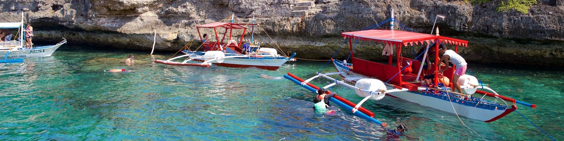 Pescador Island which includes boating and rocky coastline