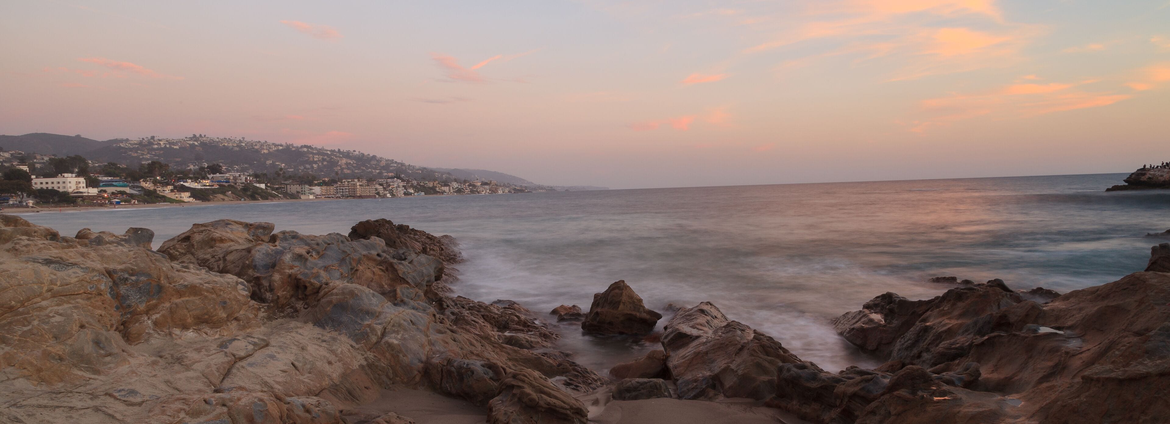 Long exposure of rocks in waves, giving a mist like effect over ocean in Laguna Beach, California