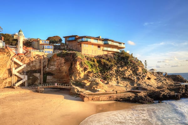 Blue sky over the coastline of One Thousand Steps Beach with tidal pools and cliffs in Laguna Beach, California, USA