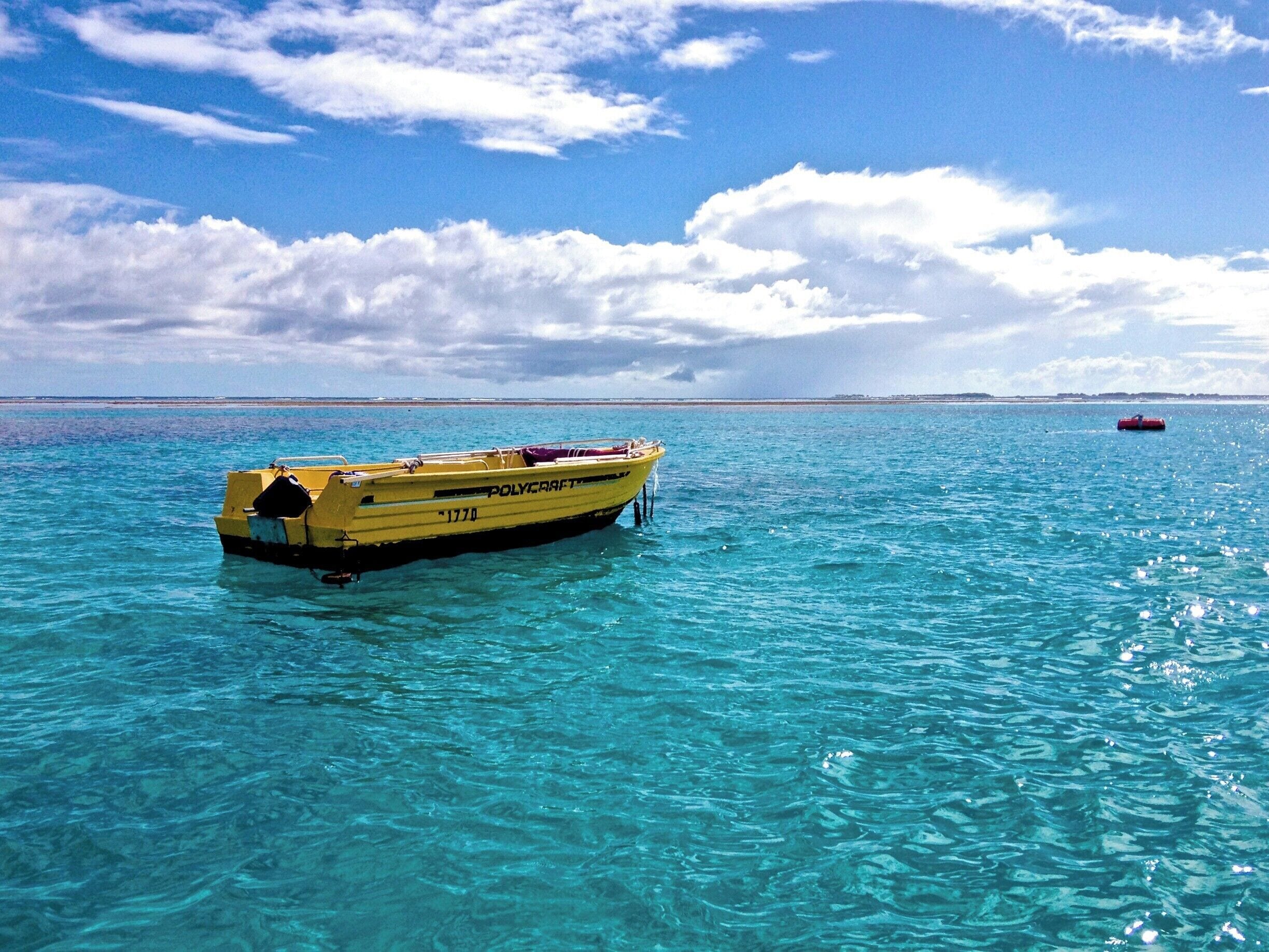 Blue skies and clear waters in the southern most part of Great Barrier Reef.

A yellow boat just chillin' around the Lady Musgrave Island, the southern most part of the Great Barrier Reef.