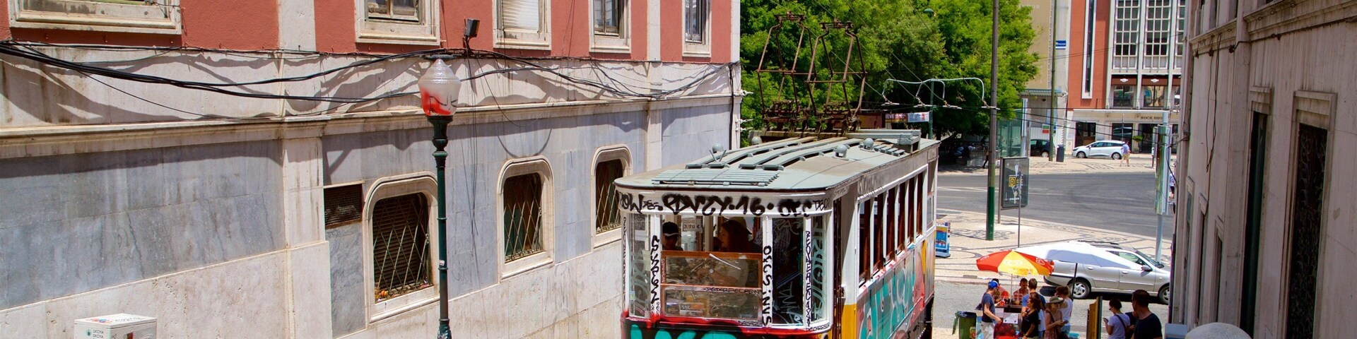 Ascensor da Gloria showing street scenes, outdoor art and railway items