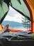 Bulgaria, man's leg in a tent with view to water