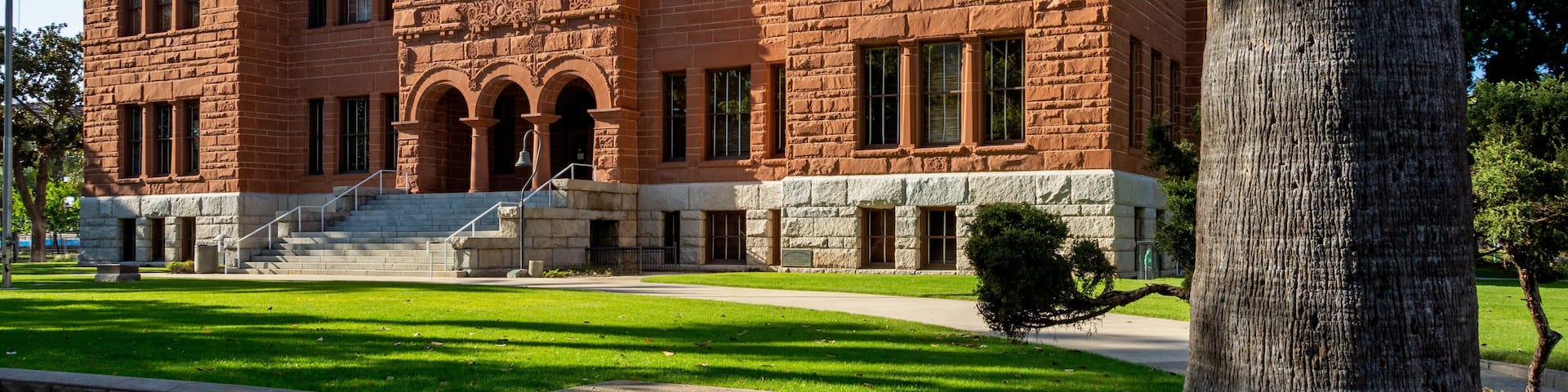 Old Orange County Courthouse, dedicated in 1901, is a granite and sandstone Romanesque Revival building located in the Santa Ana Historical Downtown District.