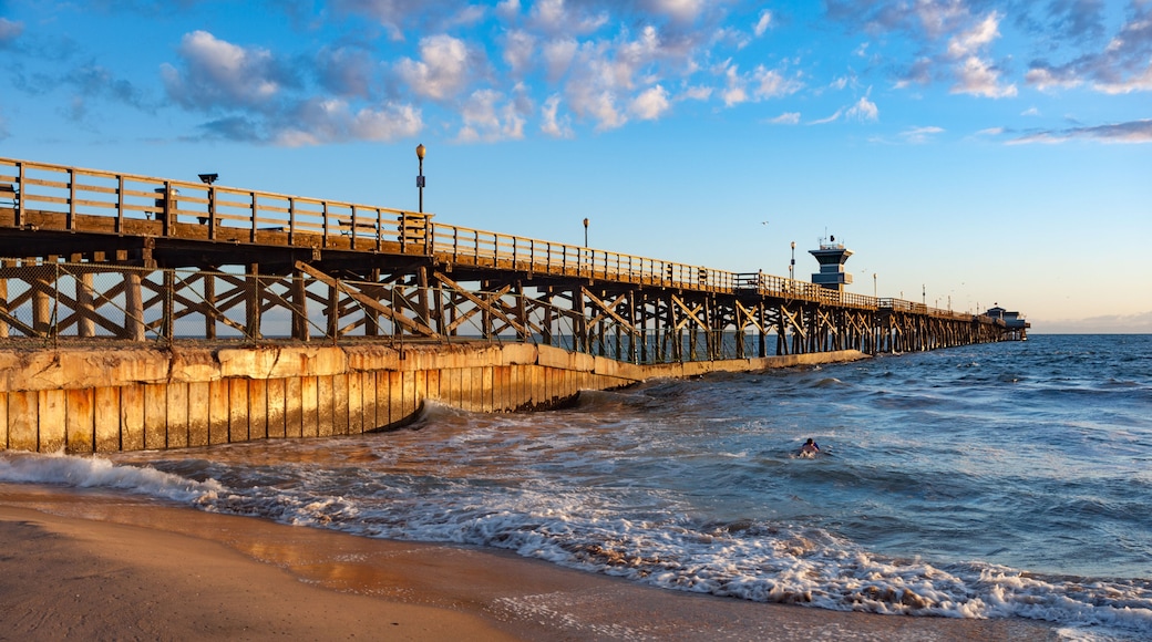 Sunset light hitting seal beach pier in southern California