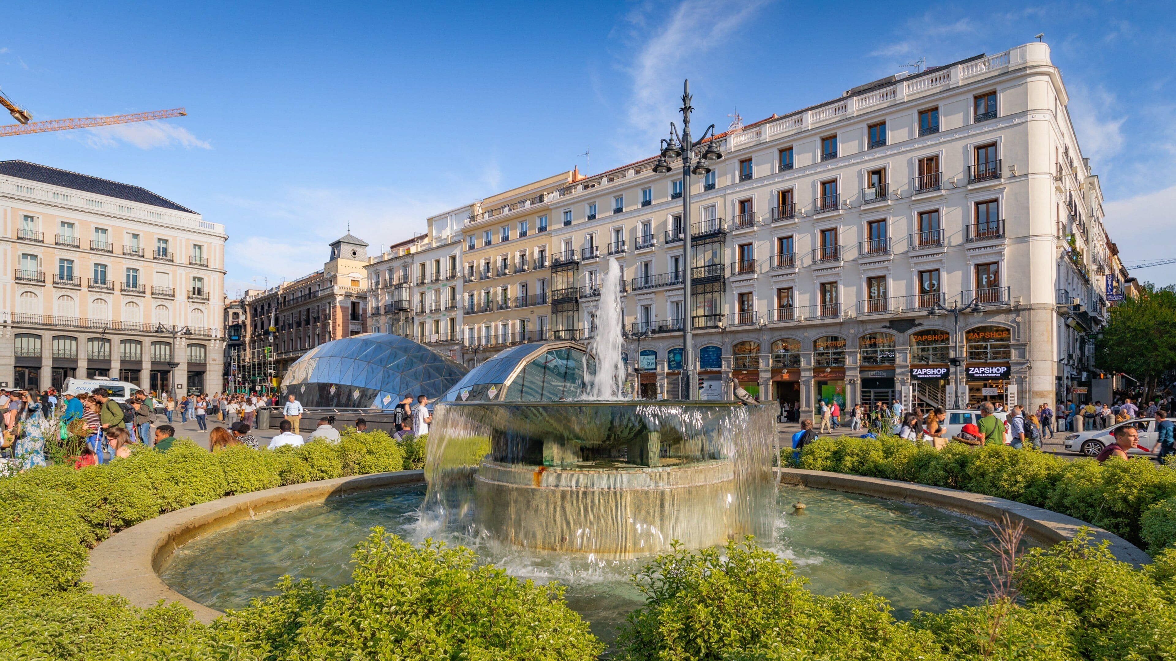 Puerta del Sol which includes a city and a fountain
