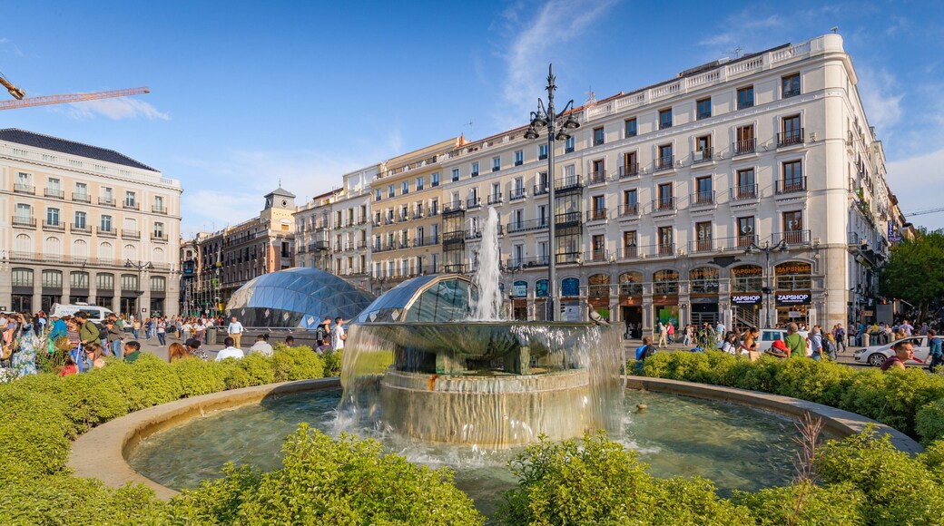 Puerta del Sol which includes a city and a fountain