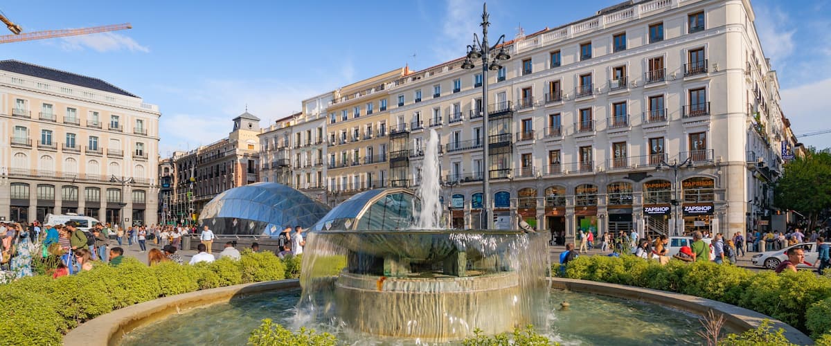 Puerta del Sol which includes a city and a fountain