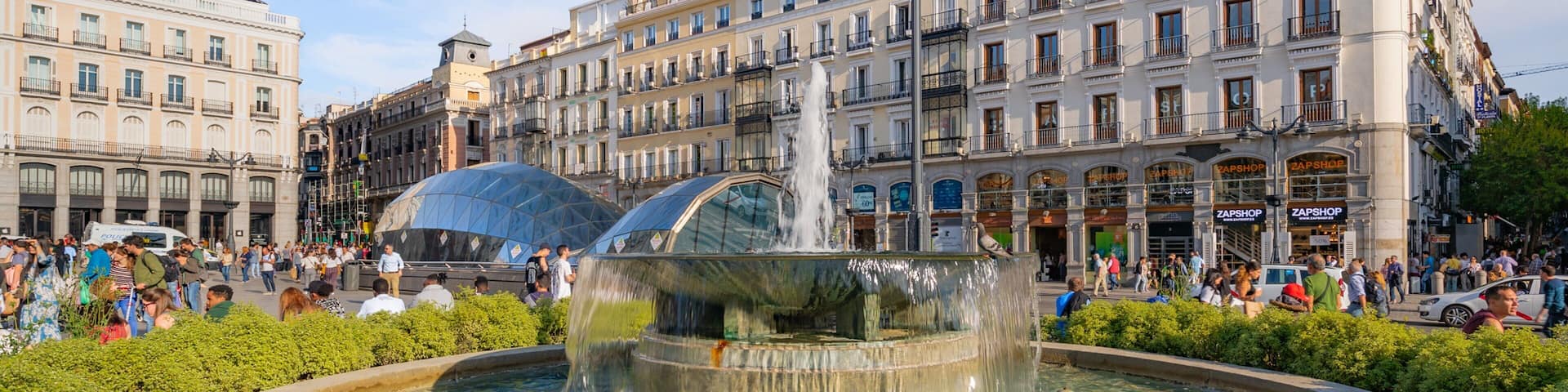 Puerta del Sol which includes a city and a fountain