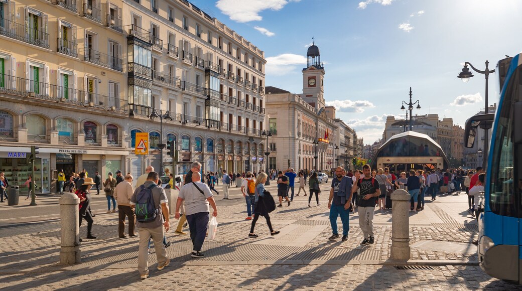 Puerta del Sol showing street scenes, a sunset and a city