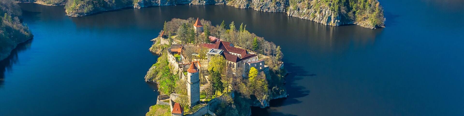 Originally a small complex, the castle was continuously extended until 1278. After the Přemyslid dynasty died out in 1306, Zvíkov became property of the Rožmberk family. After 1337 the settlement under the castle has been fortified, as a part of thorough repairs. Its fortifications were so strong that even the Hussites, during the Hussite Wars, besieged it for four months in 1429, but found it a tough nut to crack and failed to take it. To protect against heavy artillery its walls were further strengthened