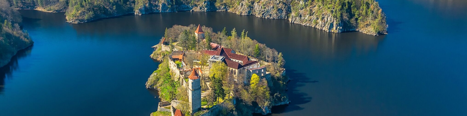 Originally a small complex, the castle was continuously extended until 1278. After the Přemyslid dynasty died out in 1306, Zvíkov became property of the Rožmberk family. After 1337 the settlement under the castle has been fortified, as a part of thorough repairs. Its fortifications were so strong that even the Hussites, during the Hussite Wars, besieged it for four months in 1429, but found it a tough nut to crack and failed to take it. To protect against heavy artillery its walls were further strengthened
