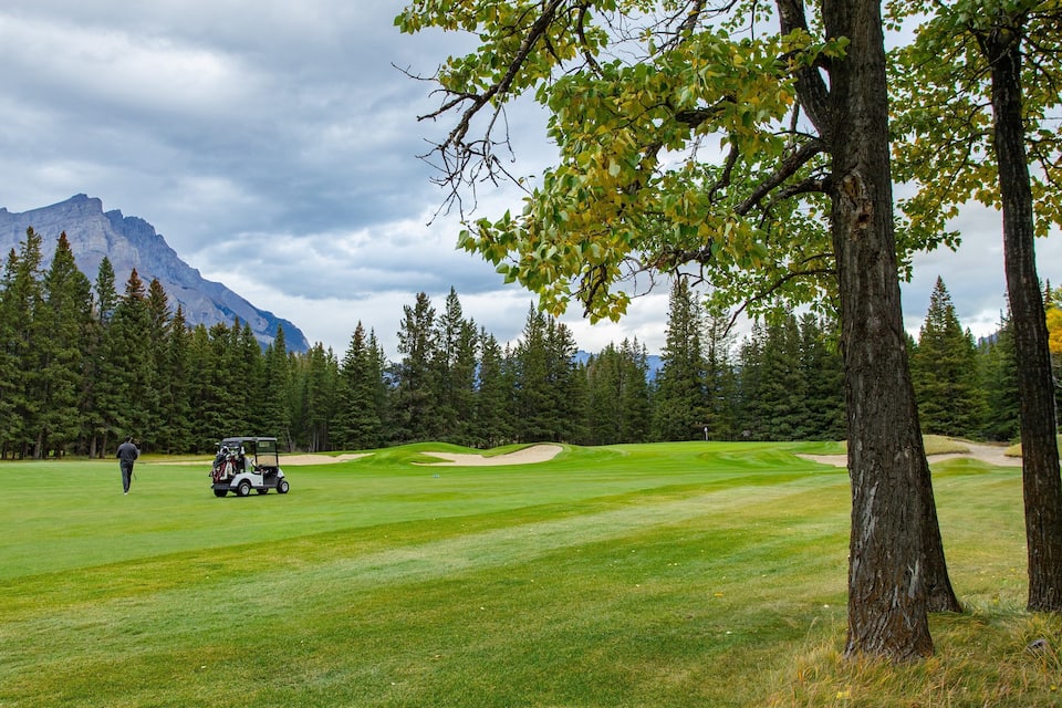 A golf course with a mountain in the background.