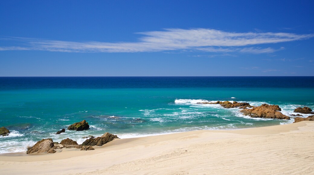 Migrino which includes a sandy beach, rocky coastline and general coastal views