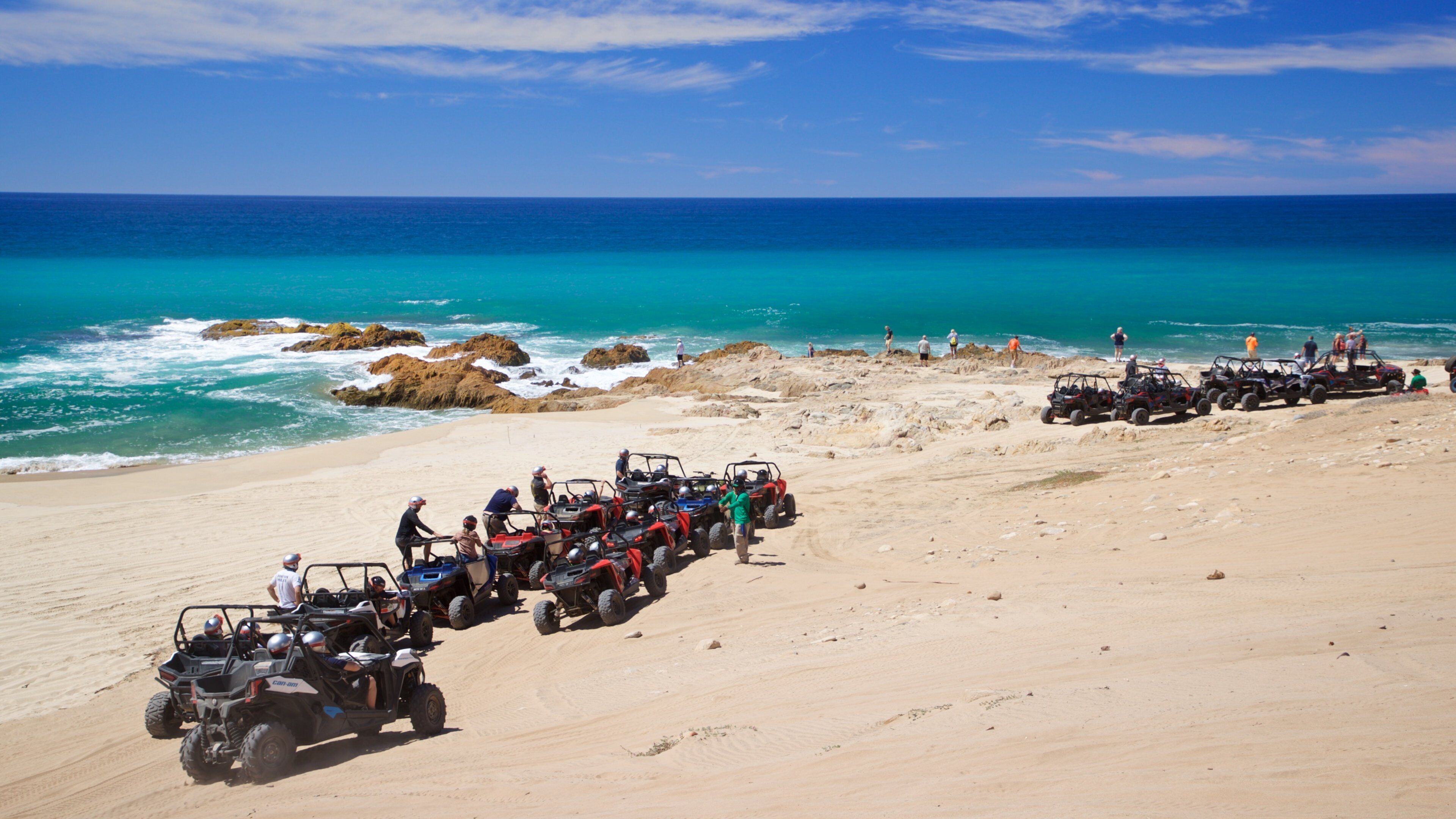 Migrino showing general coastal views, a beach and off road driving