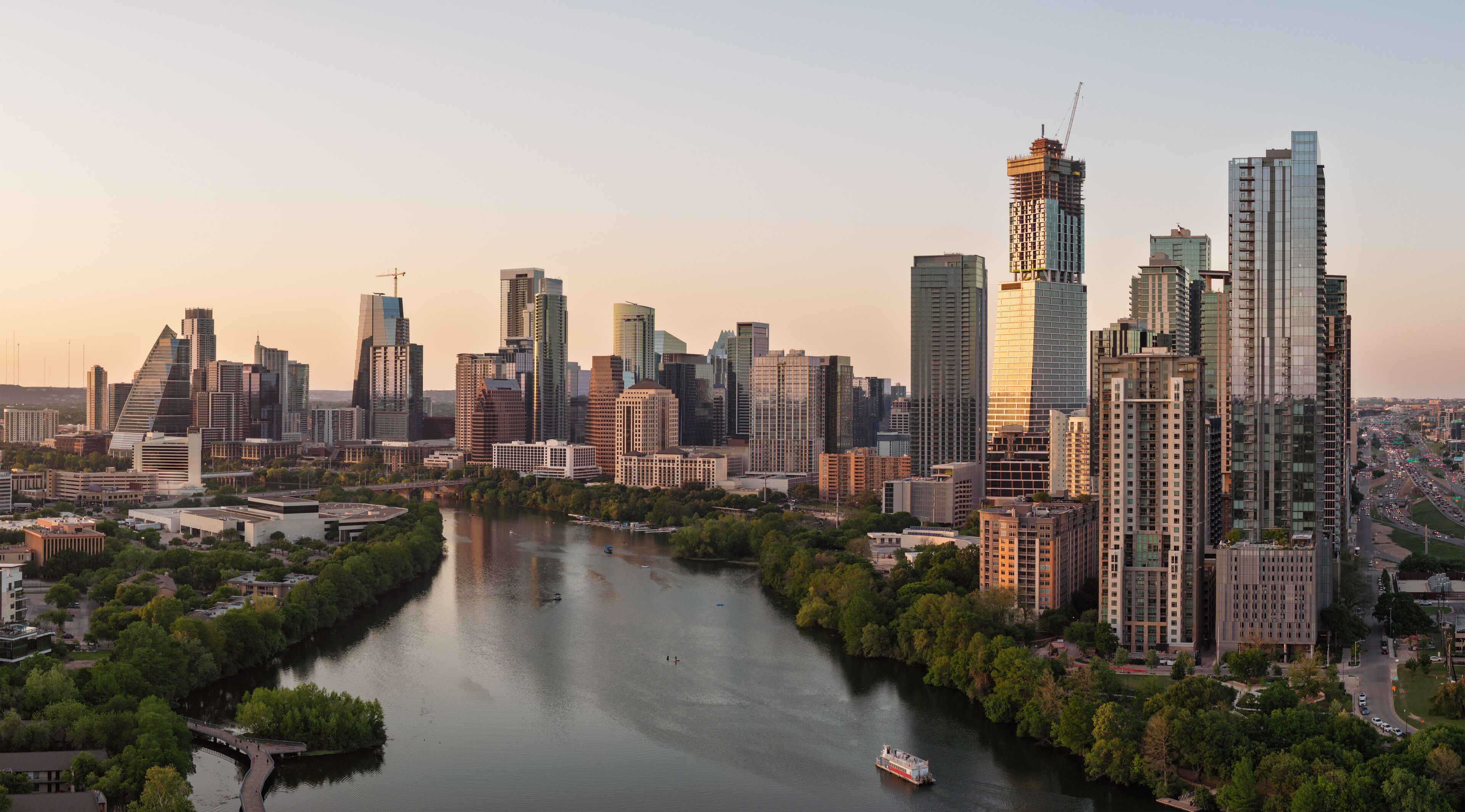 Aerial panoramic skyline of Austin Texas from the east at dusk or sunset in early 2025