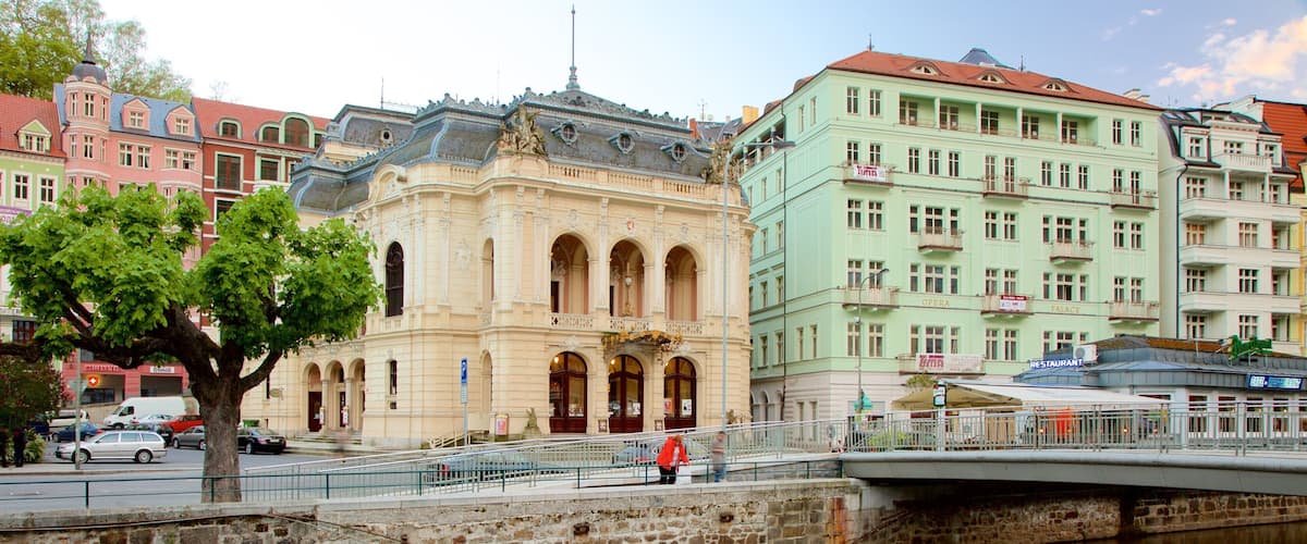Karlovy Vary Municiple Theater which includes a city and a river or creek