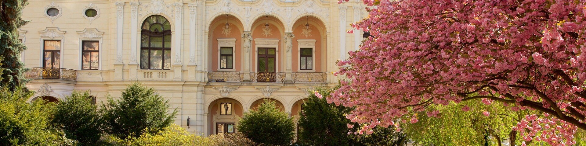 Karlovy Vary Municiple Theater featuring a garden and heritage elements