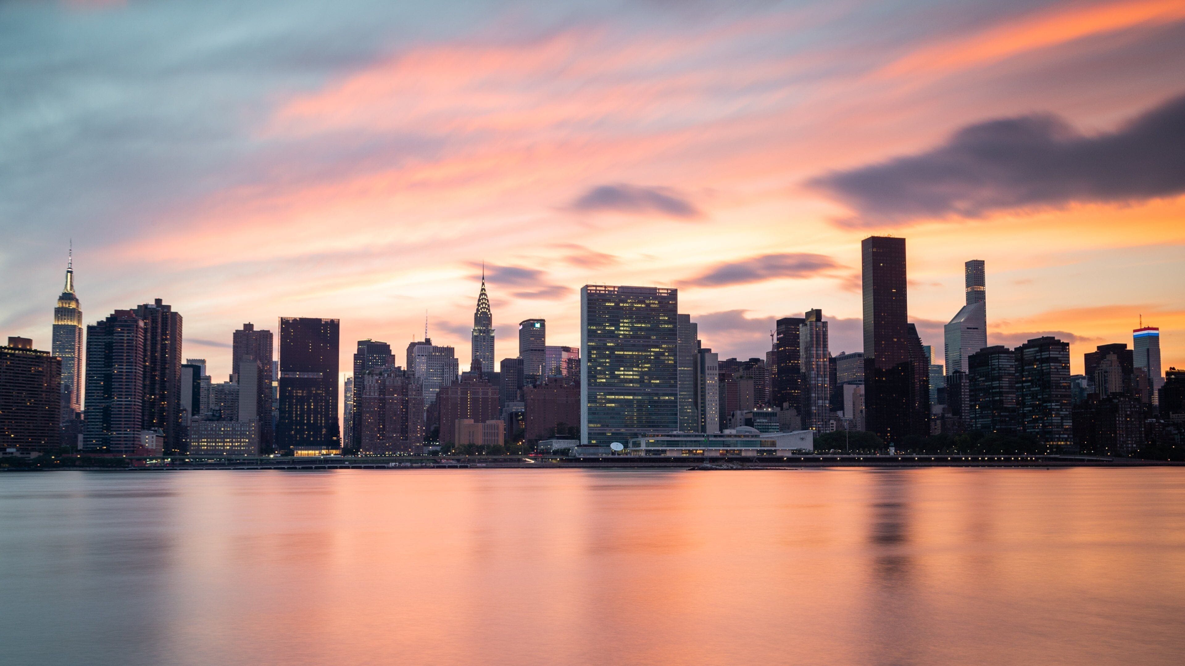 Gantry Plaza State Park featuring a city, a sunset and a bay or harbor