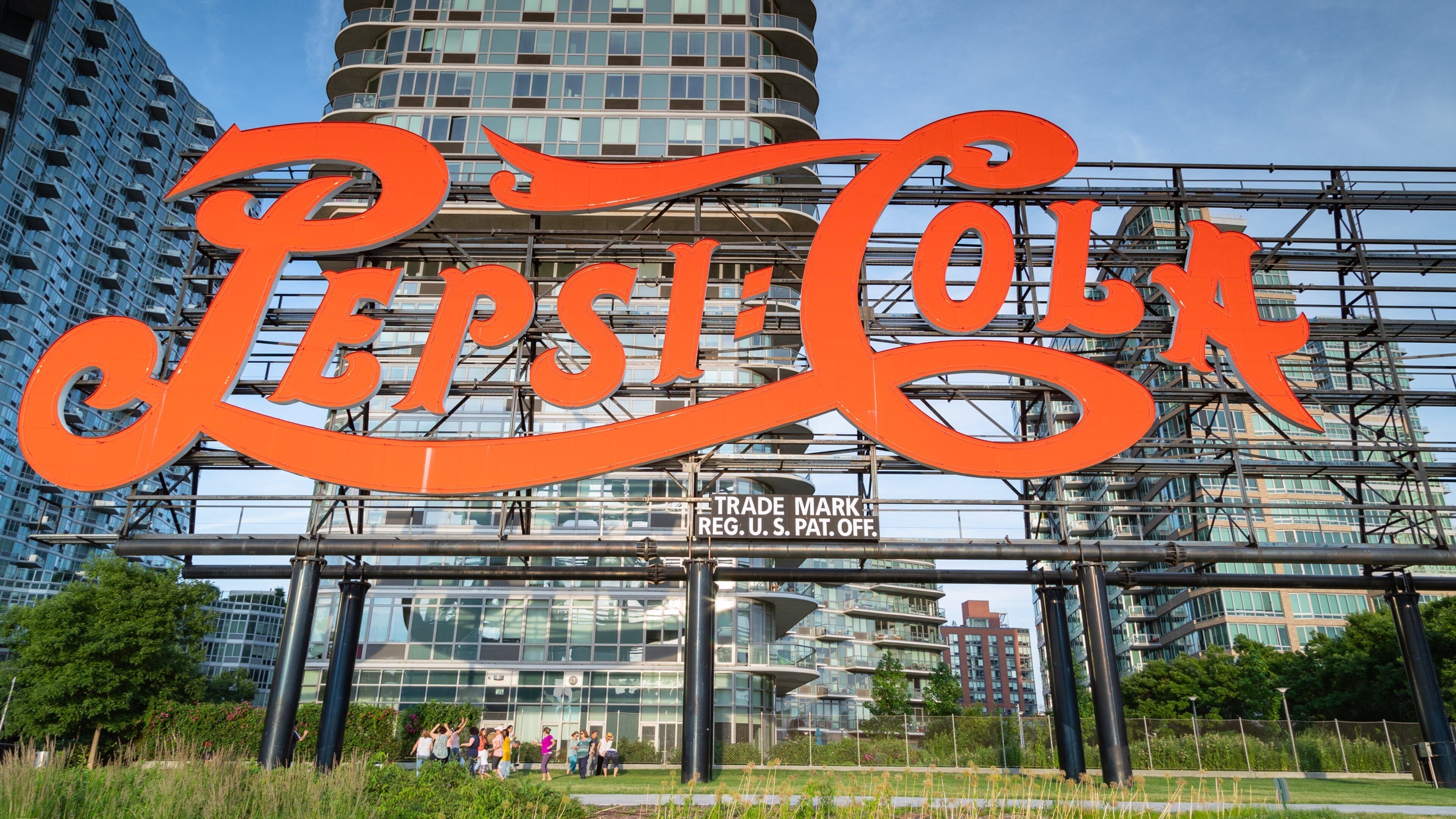 Gantry Plaza State Park featuring signage and a city
